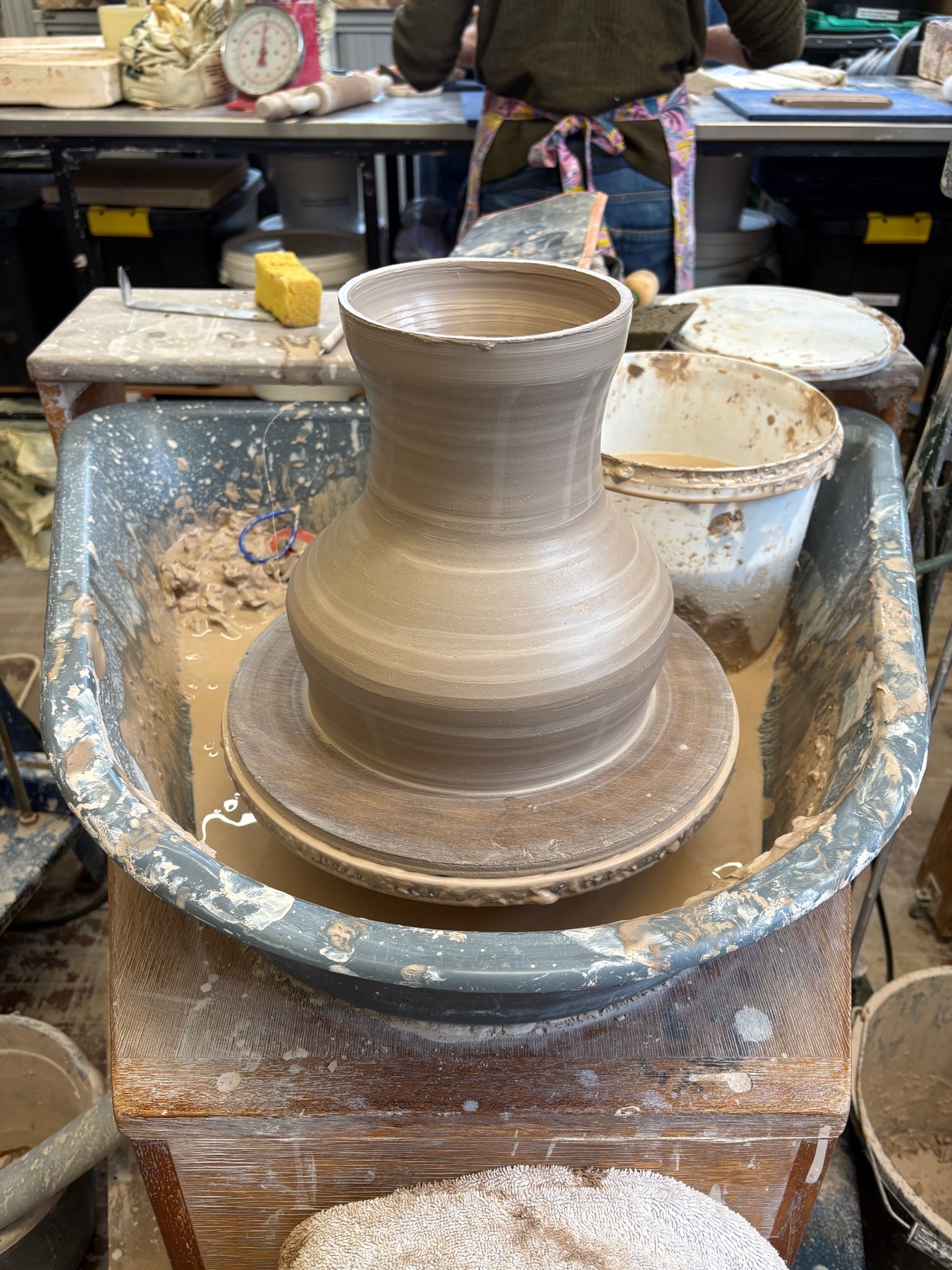 Large ceramic drum form being thrown on the wheel