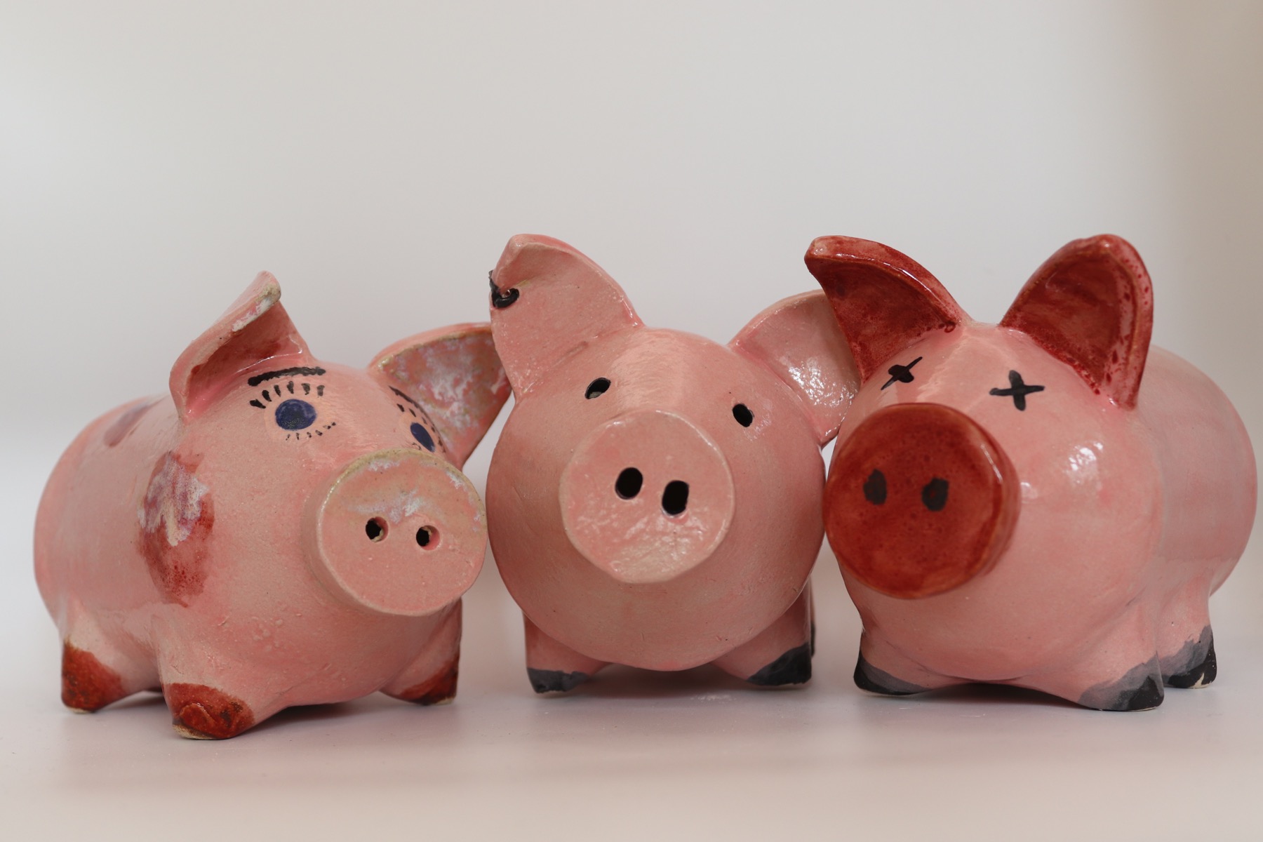 Three finished ceramic piggy-bank design tests